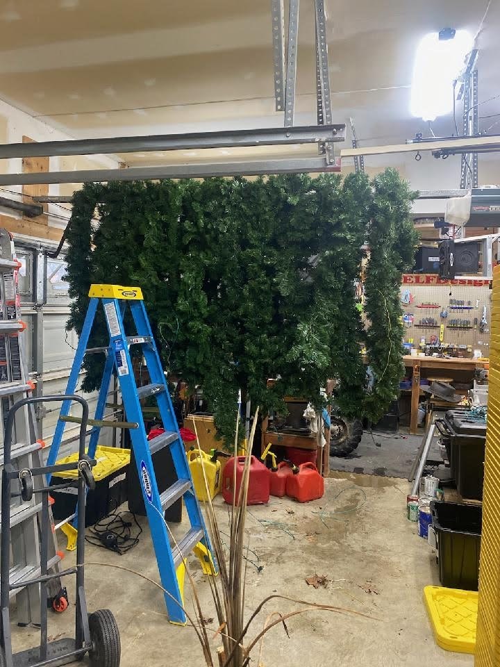 E.L.F. Designs workshop with holiday garland and lighting equipment being prepped for the season